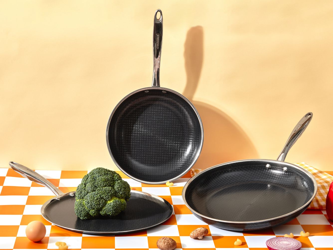 Crumble Hybrid griddle and frypans arranged with vegetables